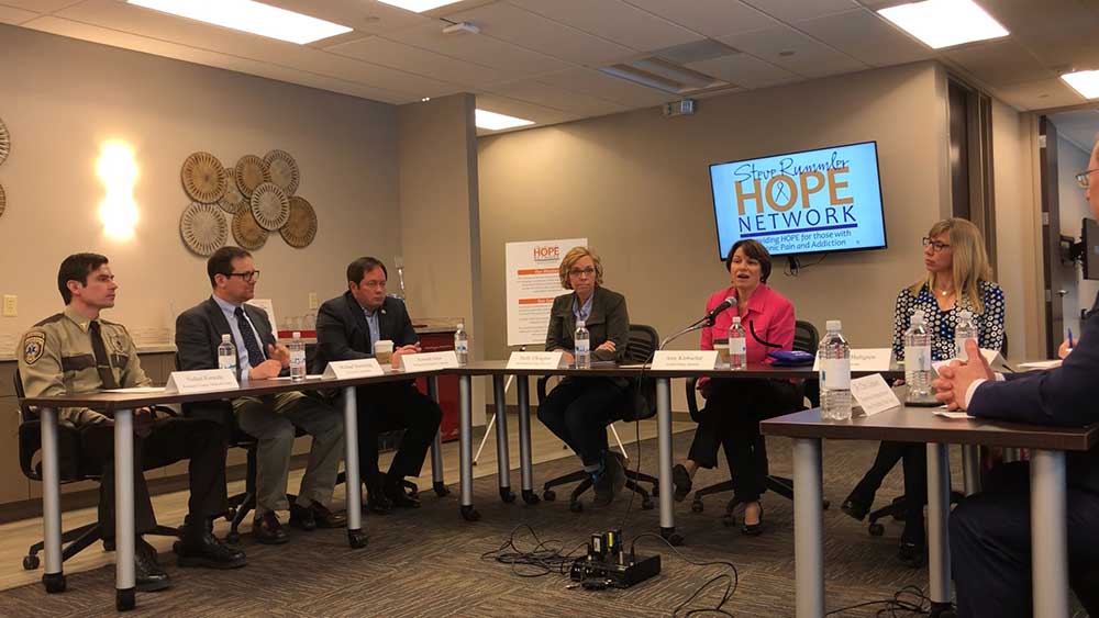 PEASE Academy Director, Michael Durchslag, shares key teen recovery information with Senator Amy Klobuchar 